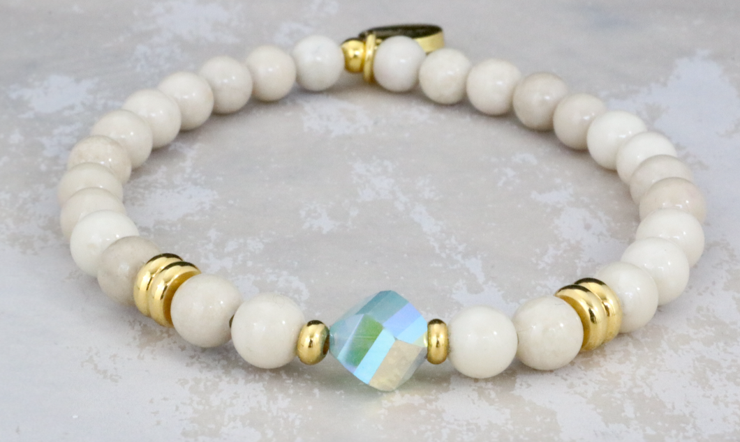 Pacific Opal Crystal on Riverstone